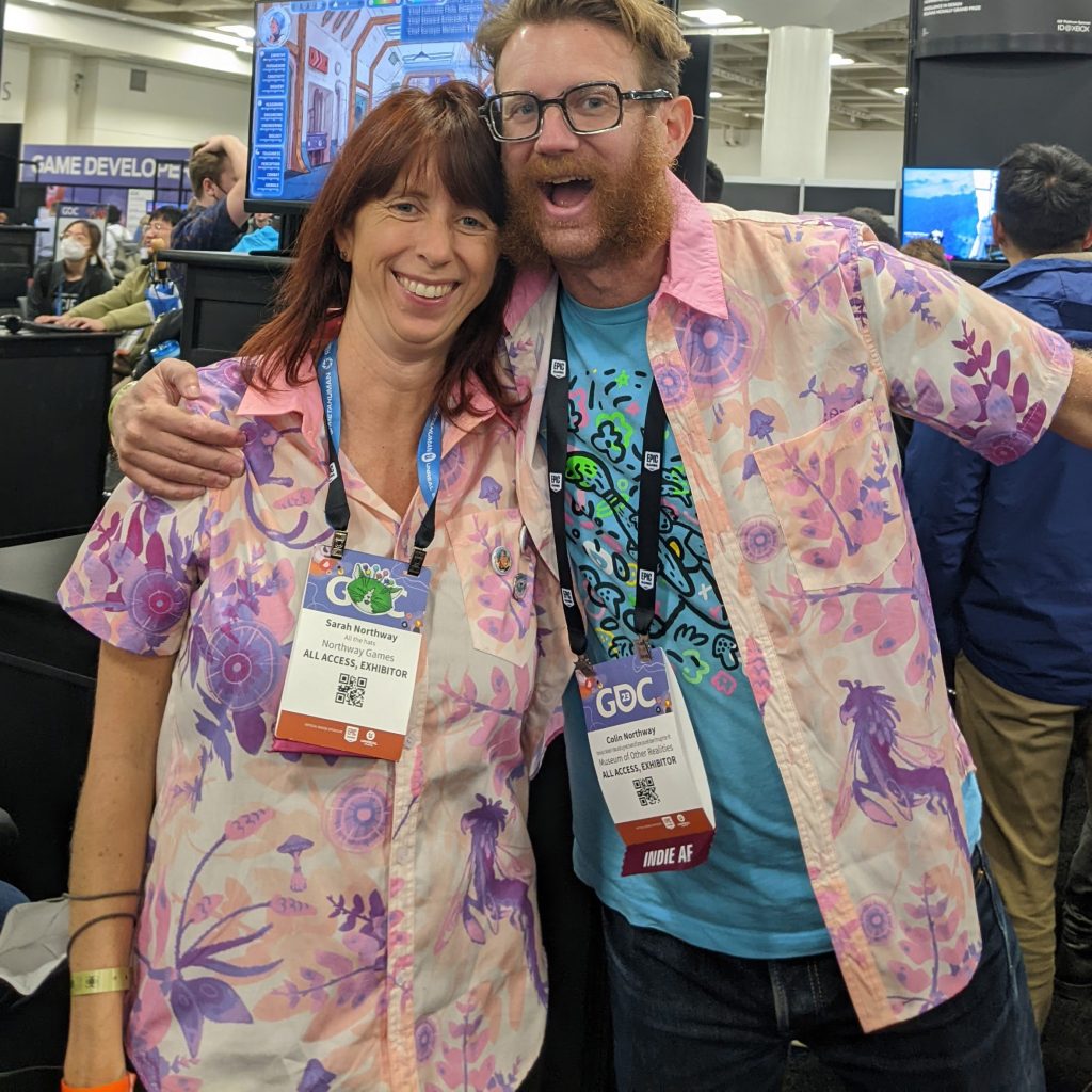 Sarah and Colin wearing Mei's pink Hawaiian shirts at GDC 2023
